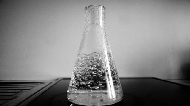 Chemical flask with boiling water
