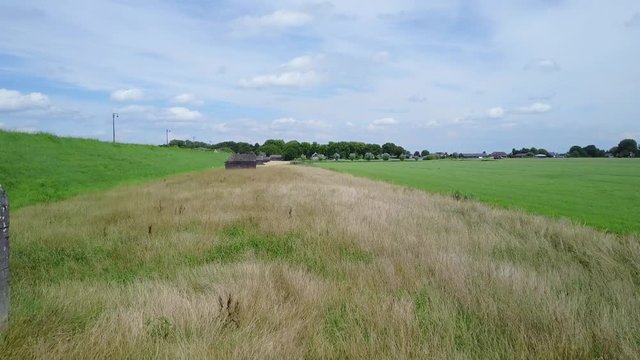 Aerial of old shelter bunkers from world war two in the middle of a meadow near Culemborg, the Netherlands &ndash; 4K