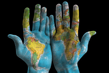Map of the world painted on hands, isolated on black