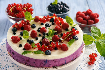 Berry cheesecake with currants, blueberries and raspberries.