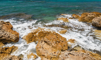 Rocks on shore of sea near Gouves, Crete, Greece.