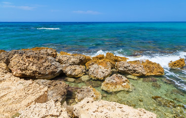 Fototapeta na wymiar Rocks on shore of sea near Gouves, Crete, Greece.