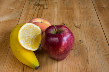 Banana, apple, peach and lemon