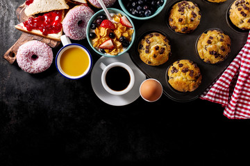 Tasty fresh breakfast food ingredients on black dark background. Ready to cook. Home Healthy Food...