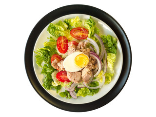 Tuna salad on the white and black plates top wiew