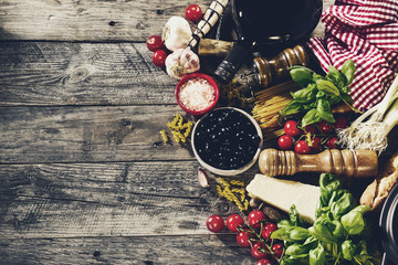 Tasty fresh appetizing italian food ingredients on old rustic wooden background. Ready to cook. Home Italian Healthy Food Cooking Concept. Toning.