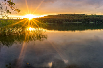 Fototapeta na wymiar Romantic sunset at the lake Breiter Luzin in Feldberg, Mecklenburg-Western Pomerania, Germany