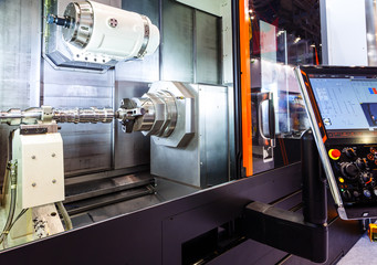 Machine tools with Computer Numerical Control CNC . CNC is the automation of machine tools that are operated by precisely programmed commands encoded on storage mediumas.