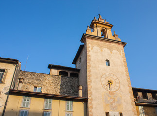 Fototapeta na wymiar Bergamo - Old city. One of the beautiful city in Italy. Lombardy. The clock tower close to Roncalli historical building during a wonderful blue sky
