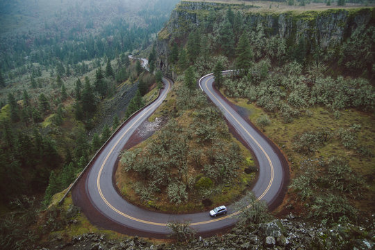 Winding road through a foggy gorge in Oregon.