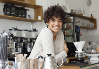 Portait of a barista inside a modern coffee shop.