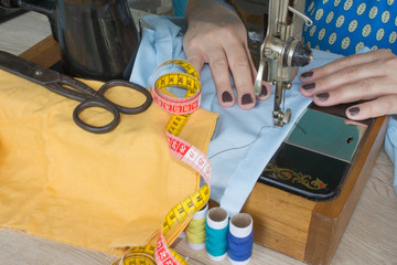 processes of sewing on the sewing machine sew women's hands sewing machine.
