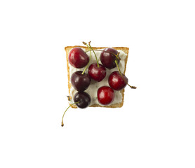 Top view. Sandwiches with cream cheese and cherries fruits. Fresh healthy appetizer snack isolated on white background.