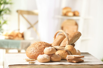 Composition with delicious bread on wooden background