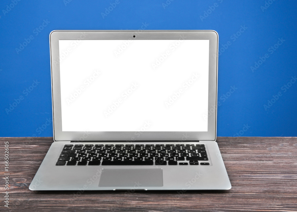 Canvas Prints Modern laptop on color background