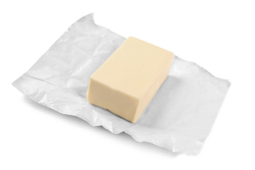 Wrapping with piece of butter on white background