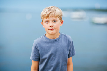 portrait of a boy on vacation at a lake