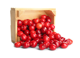 Box with sweet cherries on white background