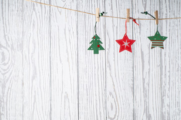 Christmas background with holiday decorations on grunge wooden board.