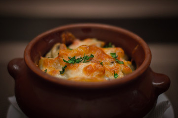Baked potatoes with cheese in the pot. National Belarusian cuisine