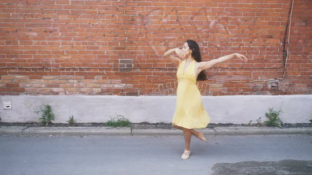 Ballerina dancing in an alley