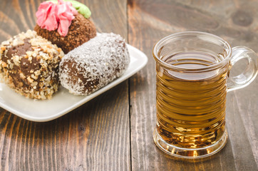 cake and cup of tea on a wooden background/cake and cup of tea
