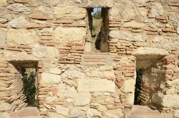 Apertures on wall in Gerona, Spain