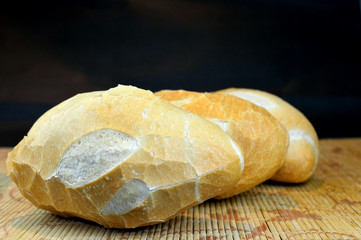 Three Brazilian Roll Bread isolated on black background