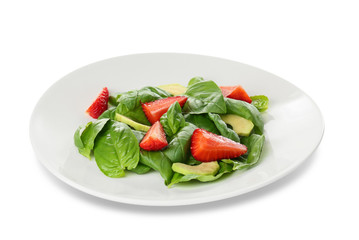 Salad with spinach leaves and strawberry on white background