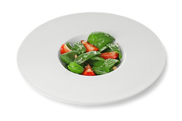 Salad with spinach leaves and strawberry on white background