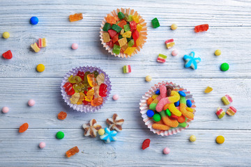 Composition with tasty candies on table