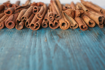 Aromatic cinnamon sticks on wooden surface