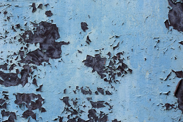 Old rusted metal with a peeling paint. Vintage industrial background