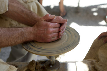 Potter making pottery