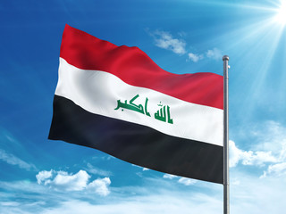 Iraq flag waving in the blue sky