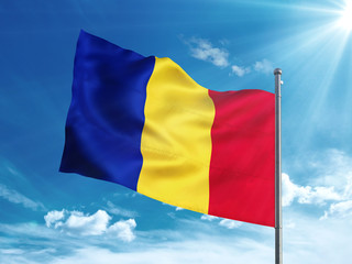 Romania flag waving in the blue sky