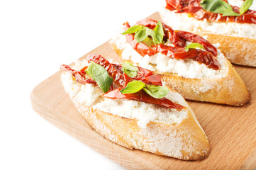 Italian sandwiches - bruschetta with cheese, tomato and basil