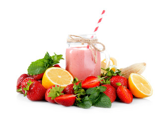 Jar of delicious strawberry homemade smoothie with fruits on white background