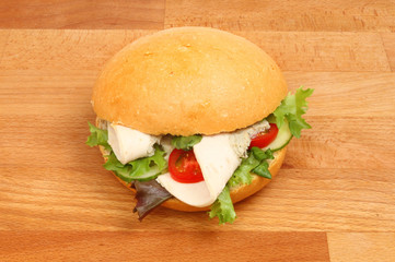 Chicken salad roll on a board