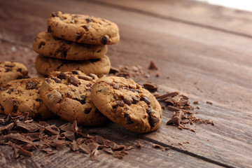Chocolate cookies on wooden table. Chocolate chip cookies shot