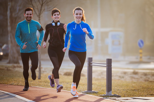 Friends fitness training together outdoors living active healthy