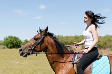 Fototapeta premium attractive woman riding horse