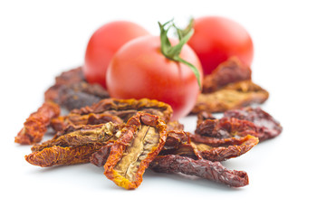 Dried sliced tomatoes and fresh tomatoes.