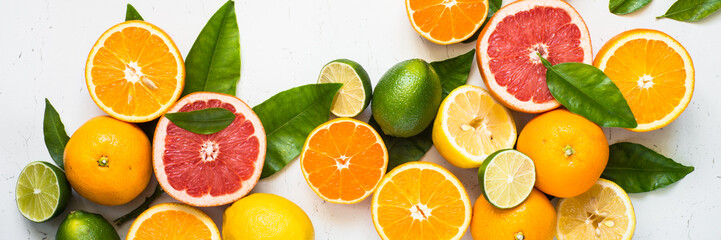 Fresh citrus fruit assortment on white.