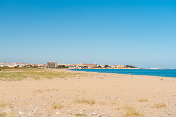 Sandy beach in L'Hospitalet de l'Infant, Tarragona, Catalunya, Spain. Copy space for text.