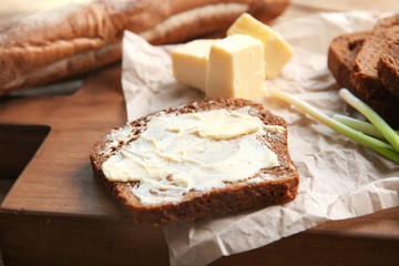 Delicious toast and butter on cutting board