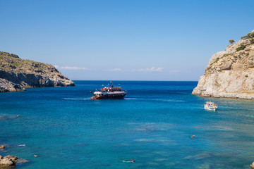 Obraz premium Anthony Quinn Bay, Rhodes in Faliraki. Beautiful beach on the island of Rhodes. One of the most beautiful bays in the city of Faliraki, Greece.