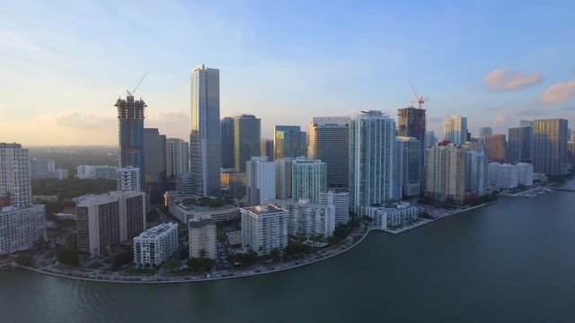 Great Aerial Shot of Downtown and Brickell in Miami from the water during sunset