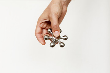 Woman's hand with spinner on neutral background