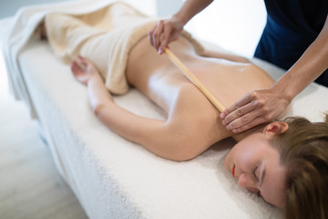 Thai massage therapist treating patient